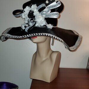 Women's Black Wide brim hat with silver and black and white trim and a accent.